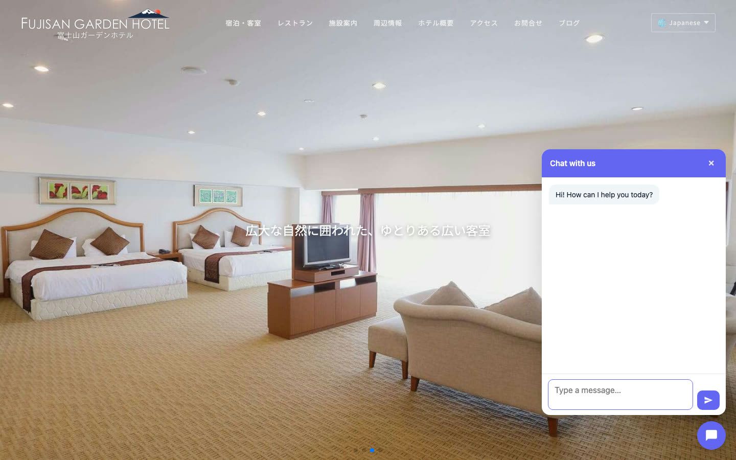 A visitor view of the Fujisan Garden Hotel website with the chat widget open in the corner, greeting the visitor and ready to take questions.